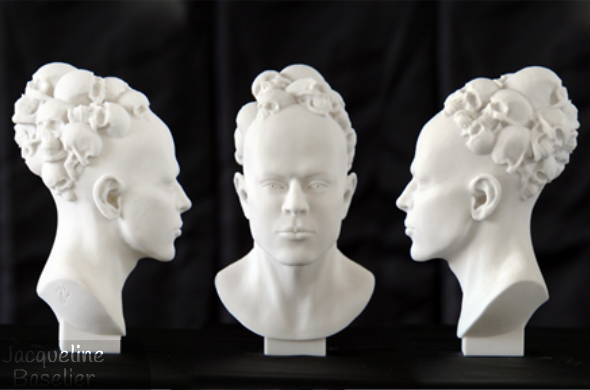 A bust of a bald human head covered with skulls. This asymmetrical design is 3D printed in resin and hand-finished.