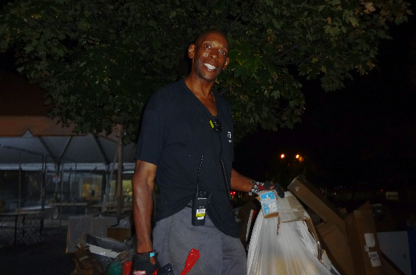 An image of one of the janitors smiling brightly