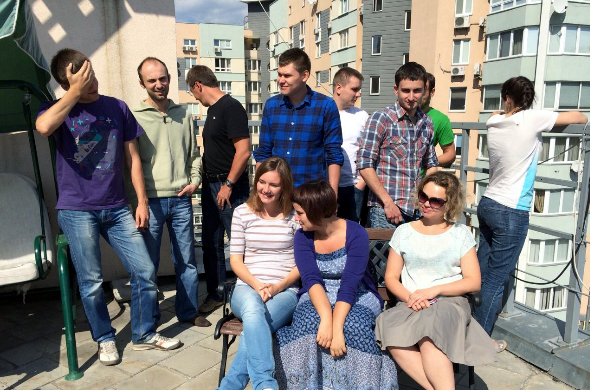 The i.materialise Kiev Team on the Materialise rooftop terrace. The team includes both women and men.