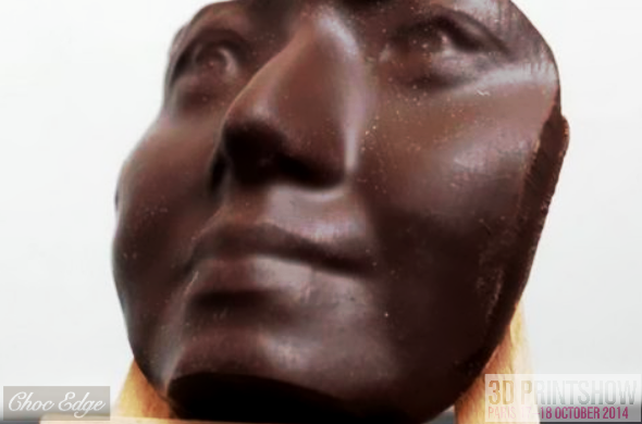 Photo of a 3D printed face scan made of light brown 3D printed milk chocolate, created by Choc Edge