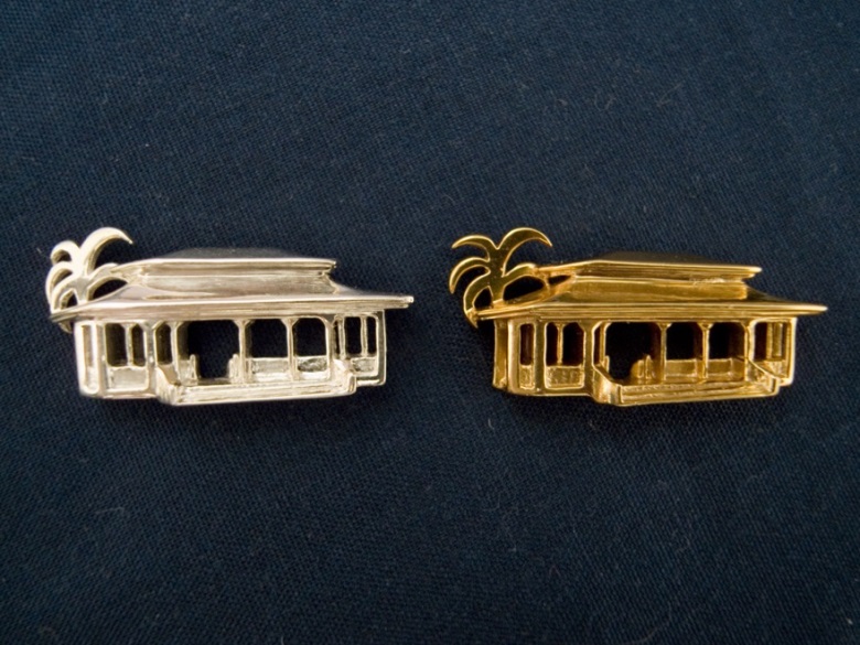 A solid silver and gold plated brass pagoda pendant
