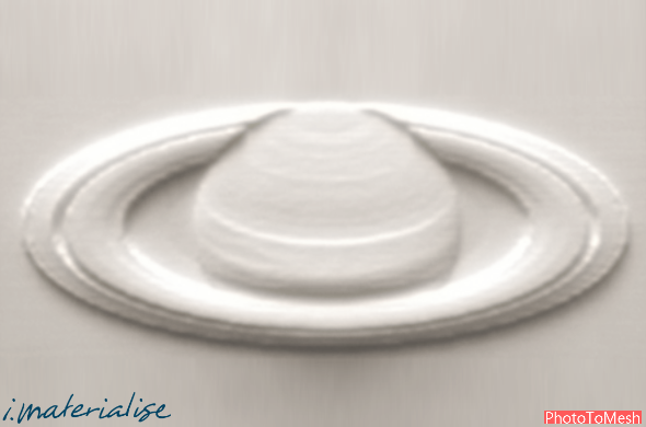 A Bas-relief of Saturn.  One side is flat, the other side has a printed, raised surface. This is an example of a tactile learning object.