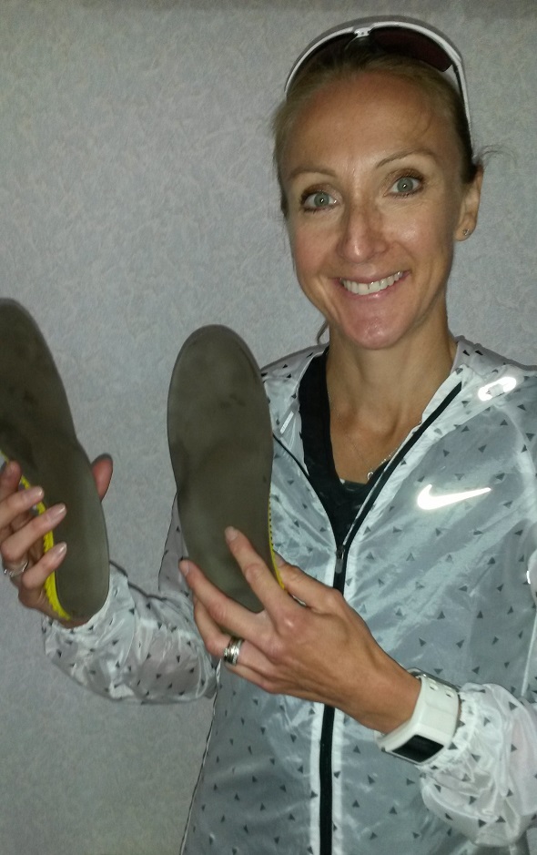 Paula Radcliffe holding her RSprint insoles