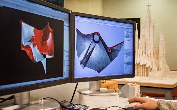 A man working on a 3D model of a Sagrada Familia cathedral with the 3D printing software Magics by Materialise 