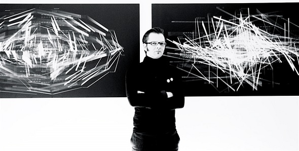 Frederik De Wilde in front of artwork from his [NRS] series