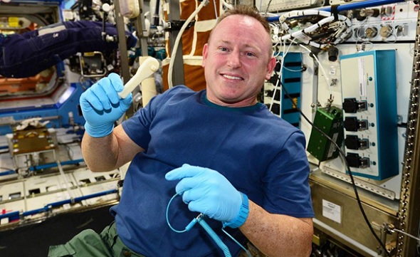 ISS Commander Butch with his new 3D printed ratcheting socket wrench (photo credit: NASA)