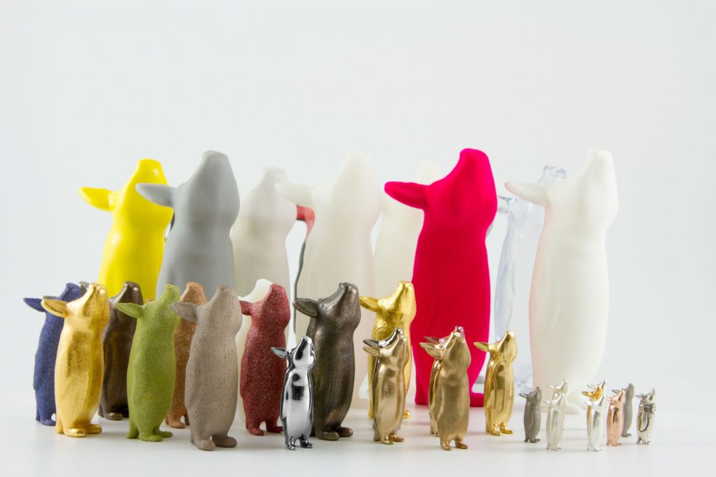 A collection of 3D-printed animals made from different materials.