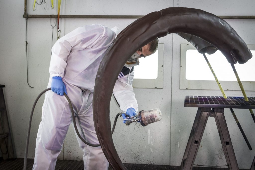 Spray painting the 3D-printed mammoth tusks