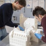 A team assembling the 3D maquette.
