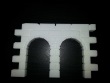 Dungeon wall with two small doorways